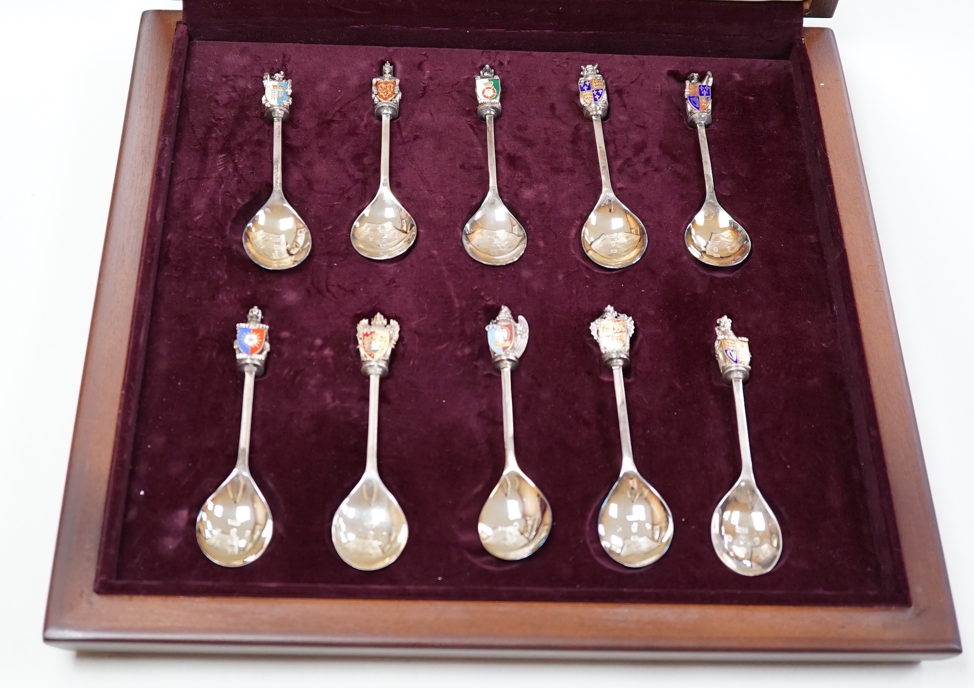 A modern limited edition cased set of ten silver and enamel 'The Queens Beasts Spoons', by Toye, Kenning & Spencer, no. 345/2500.